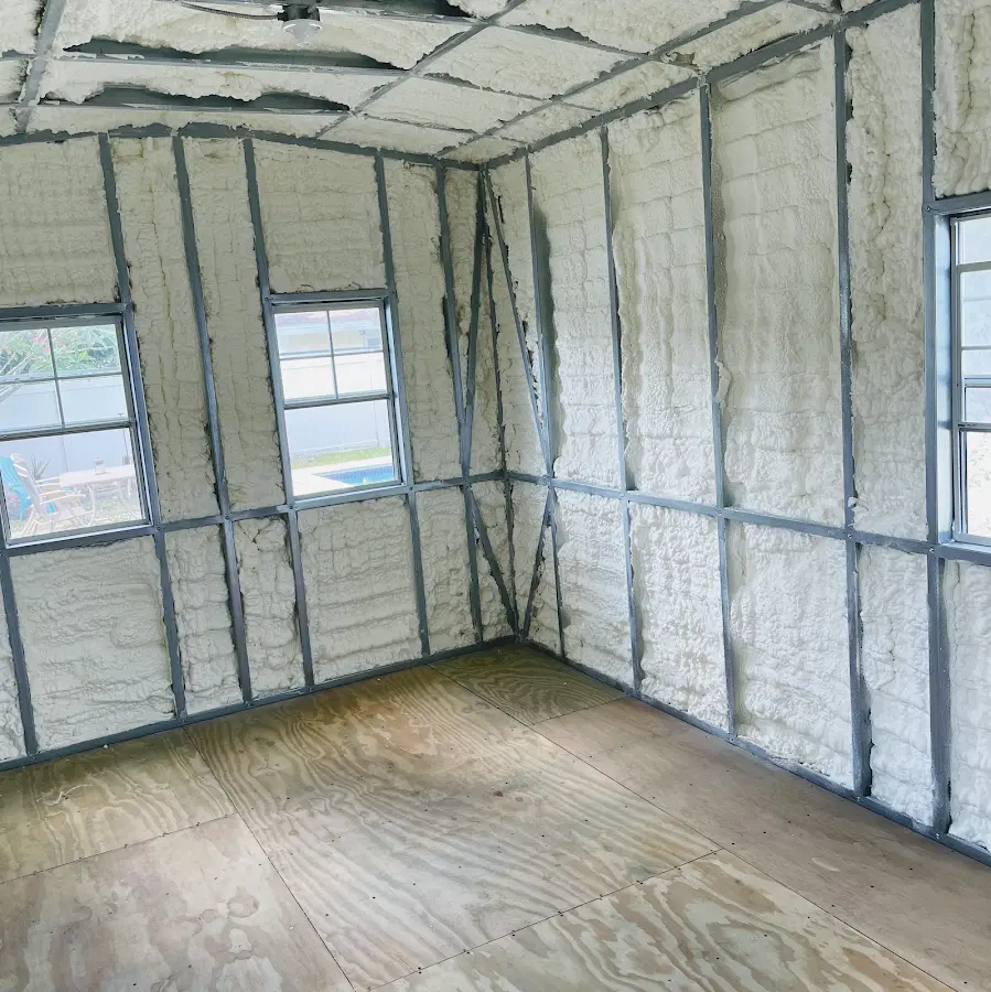 Closed-cell spray foam insulation applied to wall cavities in a residential project in Homewood